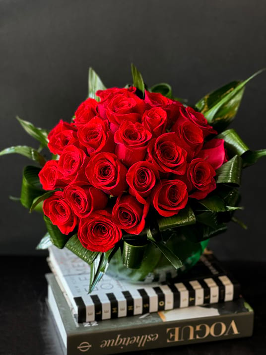 Two Dozen Red Roses In Clear Vase