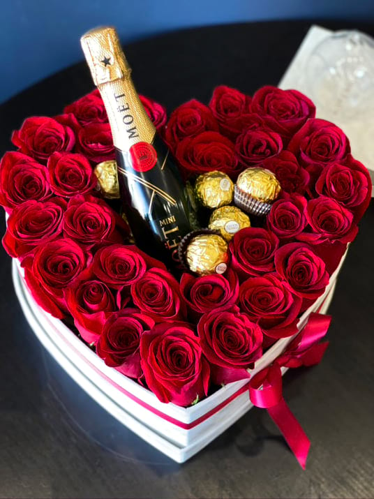 Heart Shaped Box With Red Roses Chocolate And Champagne