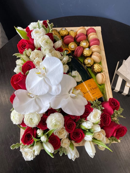 Gift Box In White And Red Flowers With Champagne Macaroons And Chocolates