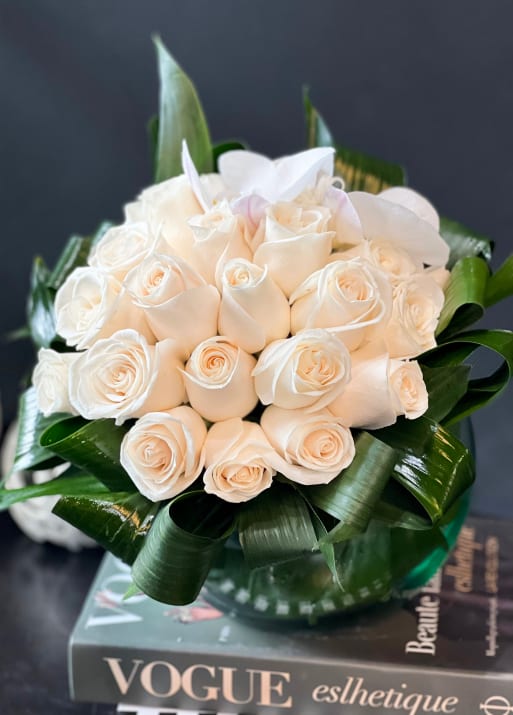 Two Dozen White Roses In Clear Vase